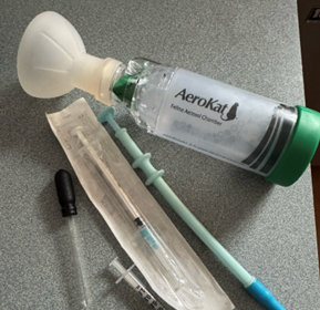 An inhaler for a cat, pill gun and various syringes.